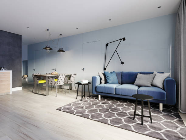 istock small studio apartment with kitchen, dining room and living room with sofa. Interior in blue and white colors and wooden elements. 1249340723