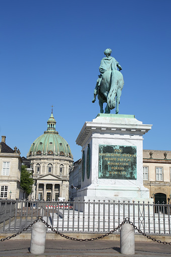 Amalienborg Palace Square with a statue of Frederick V on a horse. It is at the centre of the  Amalienborg palace, which is the home of the Danish royal family, Copenhagen, Denmark.