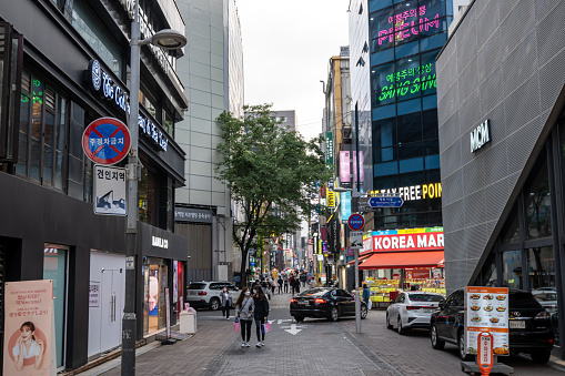 Various shops and restaurants along Myeongdong shopping street. Taken in Seoul, South Korea on May 16th 2020