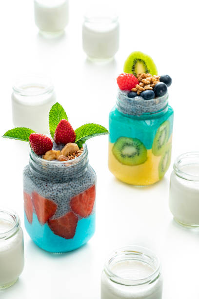 Healthy breakfast yogurt jar colorful with vanilla chia spirulina kiwi strawberries berries