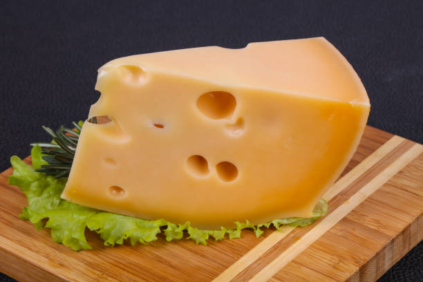 istock Maasdam cheese  in the board served salad leaves 1249345057
