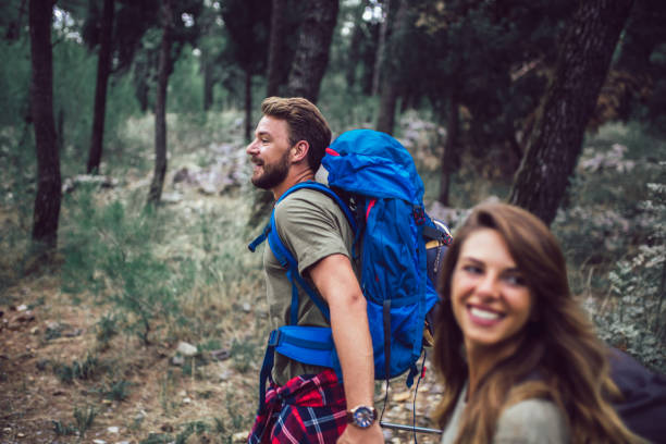 istock Romantic couple hiking on the path in mountains 1249345240