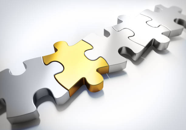istock Golden and silver puzzle parts 1249352129
