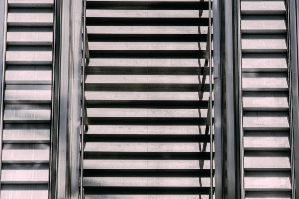 increased view of concrete stairway and escalator