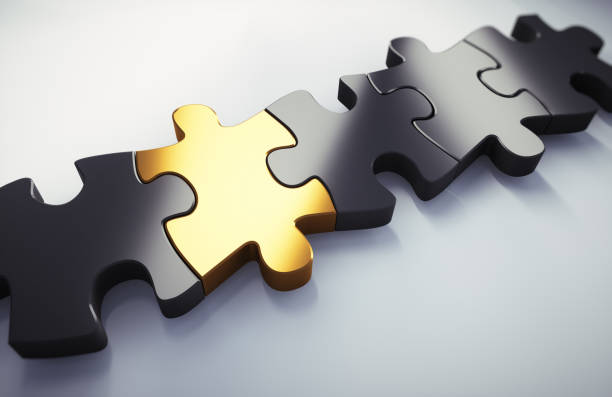 istock Golden and black puzzle parts 1249352191
