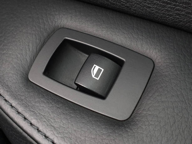 Single button for opening car window Single button for opening car window close up car door panels stock pictures, royalty-free photos & images