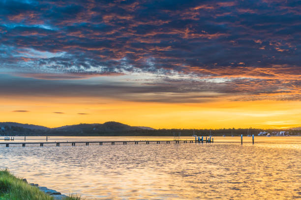 istock High Cloud Sunrise over the Bay with a yellow horizon 1249355558