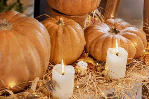 istock Halloween Pumpkins with candles straw 1249355597