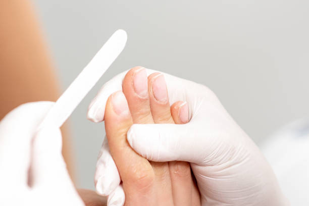 istock Manicure procedure by nail file. 1249356522