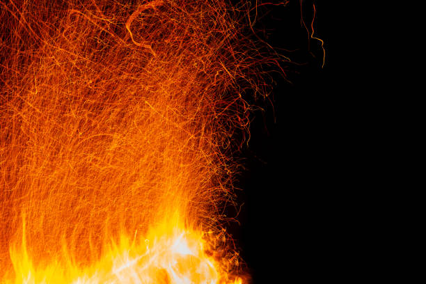 istock Multiple sparks from the fire at long exposure with free space isolated on black 1249358479