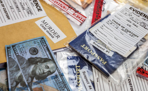 American passport of a evidence bag in laboratory of criminology, conceptual image American passport of a evidence bag in laboratory of criminology, conceptual image evidence bag stock pictures, royalty-free photos & images