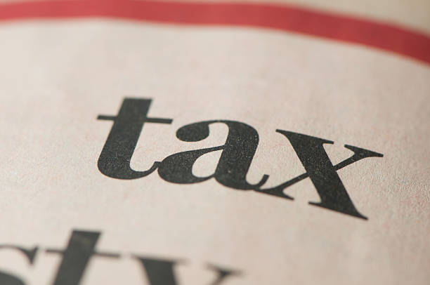 istock Tax written in newspaper, copy space, close-up 124936011