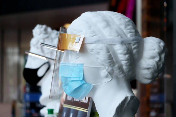 istock Mannequins in protective medical masks in a store 1249363130