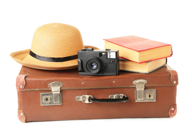 istock Vintage suitcase and accessories isolated on white background 1249364424