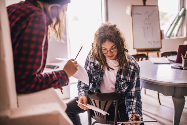 istock Team of young designers  cooperating in the office 1249365583