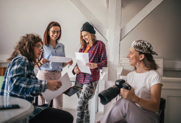 istock Team of young designers  cooperating in the office 1249366180