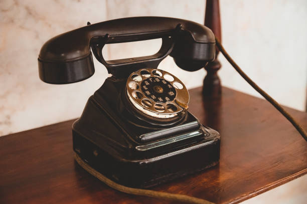 istock An old telephone with a wire is on the shelf. 1249366477