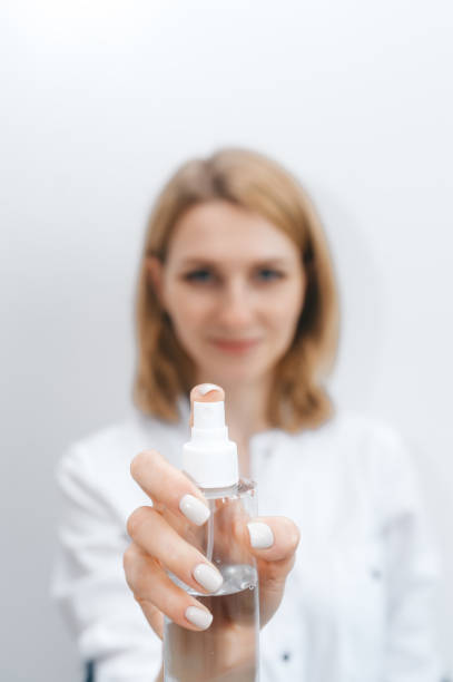 istock Woman holding antiseptic gel 1249368658