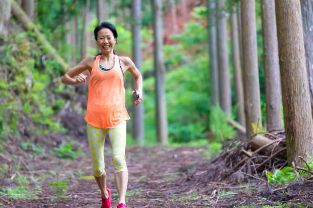istock Woman jogging in mountain 1249369914