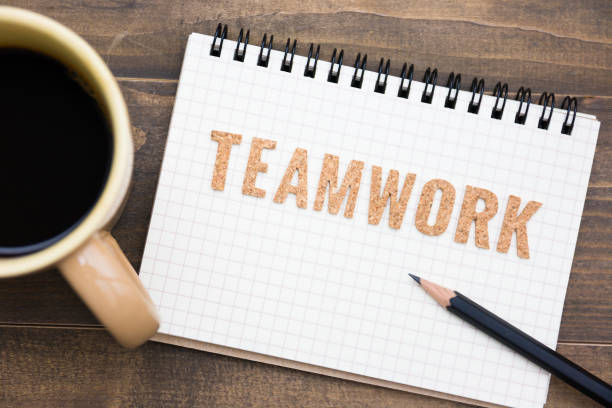 istock Office table with notebook, pencil and coffee cup. View from above. Teamwork concept. 1249370767