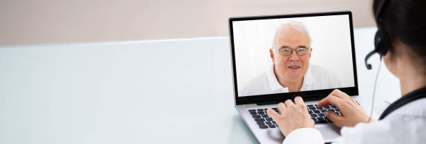istock Doctor Talking To Patient Through Video Chat On Laptop 1249377204