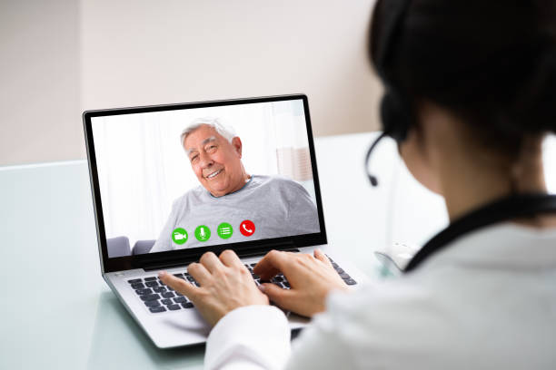 istock Doctor Talking To Patient Through Video Chat On Laptop 1249377215