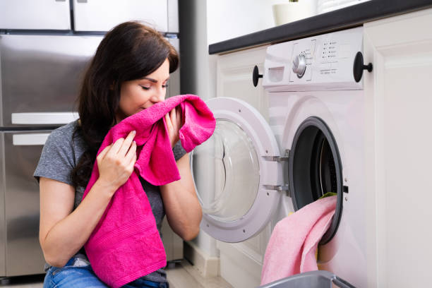 istock Woman Smelling Clothes 1249377294
