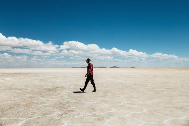 istock Alone man walking in Salar de Uyuni, Bolivia 1249377383