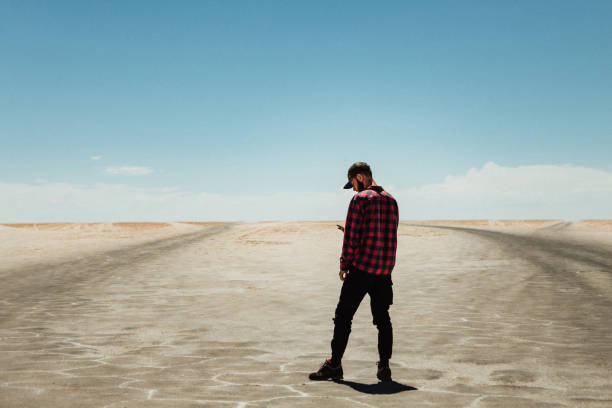 istock Alone man at Salar de Uyuni, Bolivia 1249377400