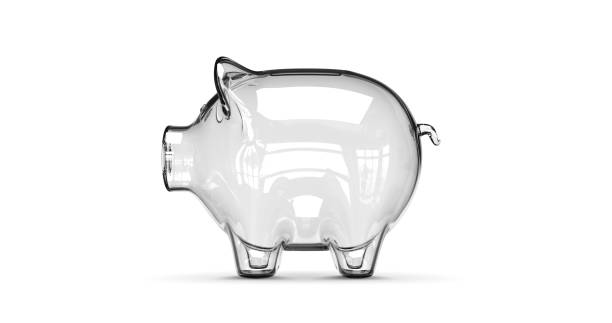 Glass piggy bank stuffed with growing coins. stock photo