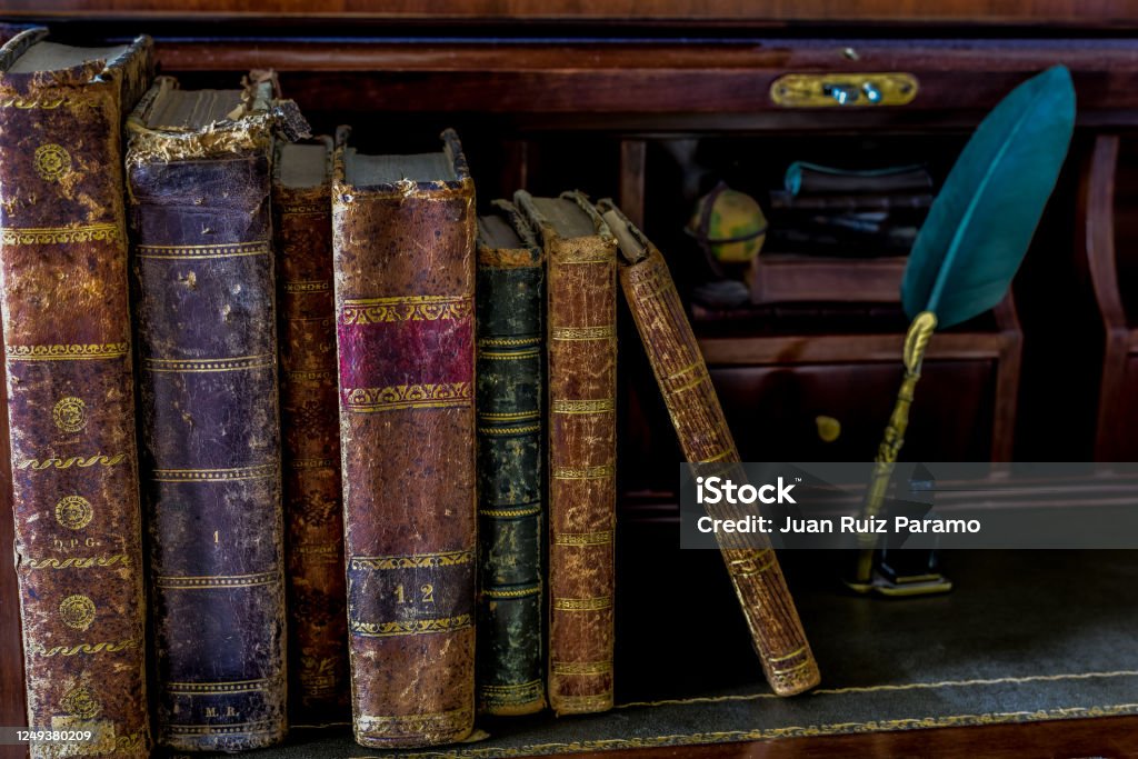 old books on desk and pen writing Poetry - Literature Stock Photo