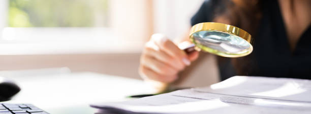 istock Auditor Investigating Corporate Fraud 1249380307
