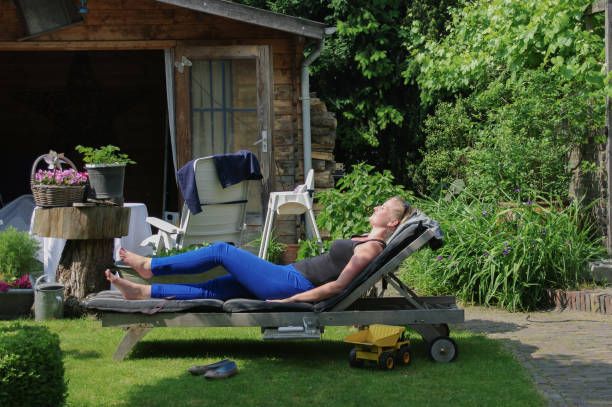 istock Woman on lounge chair 1249383006