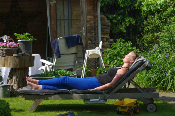 istock Woman on lounge chair 1249383020