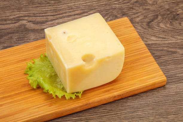 istock Emmental cheese over wooden board 1249383790
