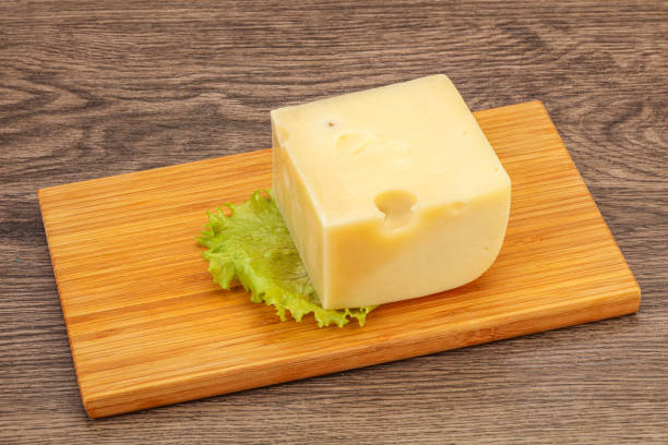istock Emmental cheese over wooden board 1249384200