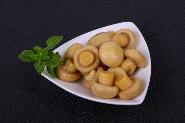 istock Pickled champignon heap in the bowl 1249384690