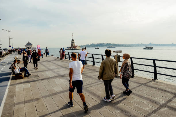 Normalization period in Coronavirus epidemic in Istanbul Istanbul / Turkey - Jun 6 2020: Citizens spend time in Salacak coastal line in Uskudar in Covid19 epidemic normalization period. maidens tower turkey photos stock pictures, royalty-free photos & images