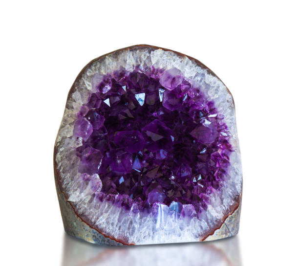 Amethyst crystal, semiprecious gem isolated on white background.