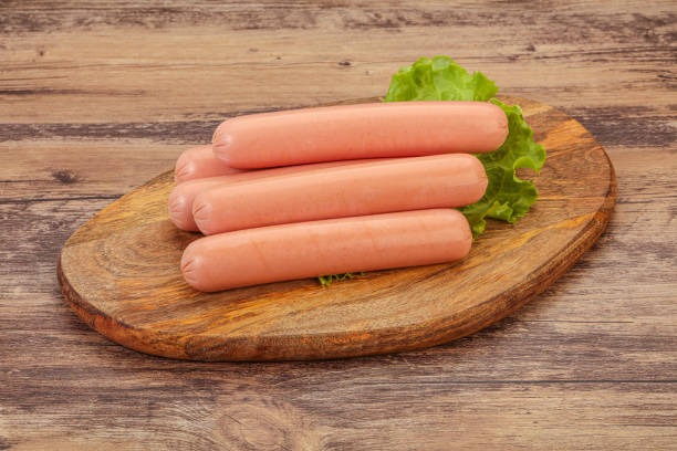istock Tasty meat sausages over board 1249386902