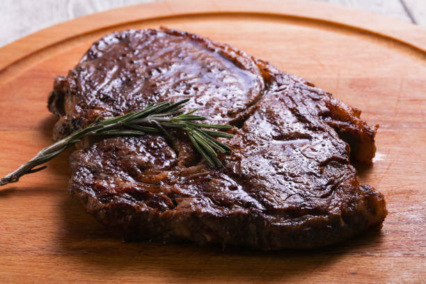 istock Ribeye steak with rosemary 1249387130