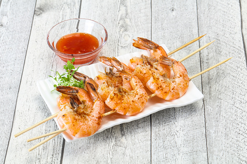 Grilled prawn skewer with spicy sauce
