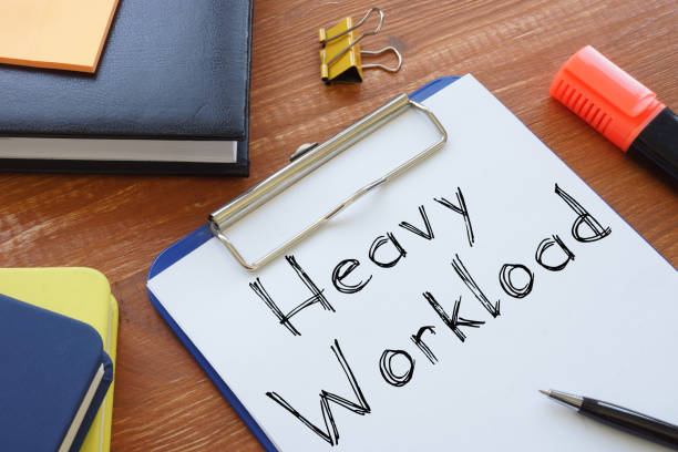 istock Heavy Workload is shown on the conceptual business photo 1249390583