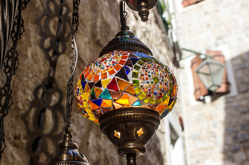 bright lamp of glass mosaic, a national souvenir for tourists in the old city of Montenegro