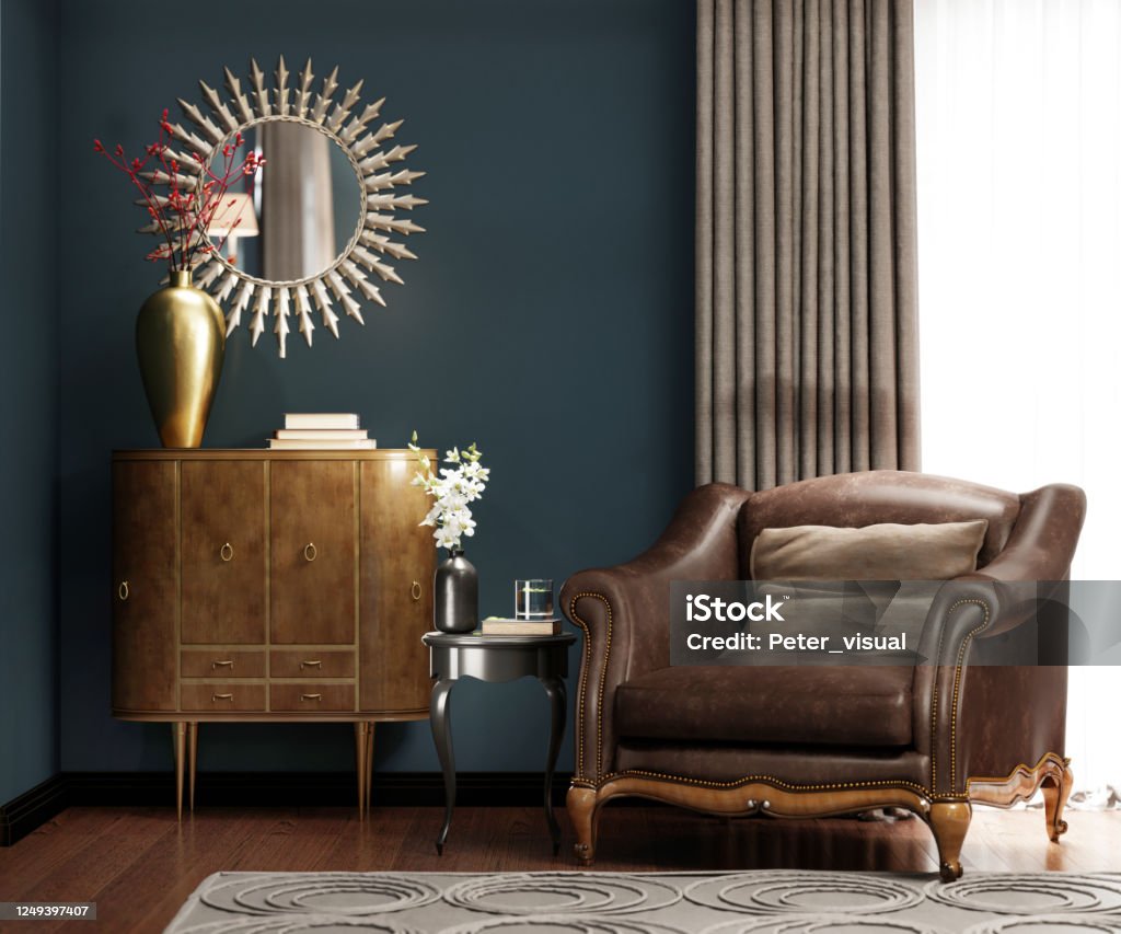 A classic leather armchair with a brown pillow, near the golden chest of drawers with decor, by the window. A classic leather armchair with a brown pillow, near the golden chest of drawers with decor, by the window. 3D rendering. Antique Stock Photo