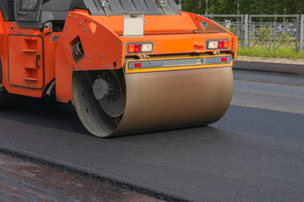 istock Urban road construction, paver. Road roller for laying new asphalt 1249397434