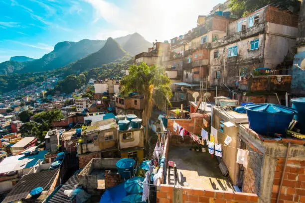 View of Rocinha slum, one of the biggest in Brazil, with big mountains at the horizon, in Rio de Janeiro.