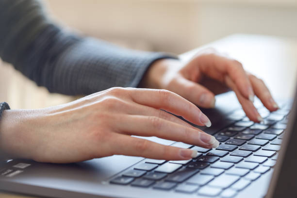 istock Woman using laptop indoor. 1249397707