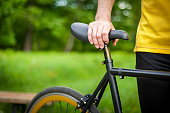 Cyclist with his bike, close up. Outdoor photography.