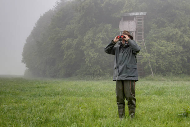 Hunter who stalks in rainy weather. stock photo